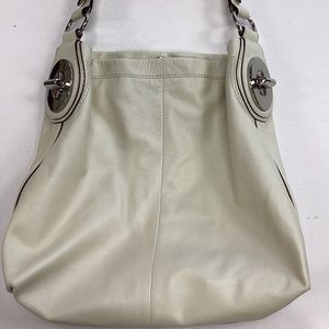 Coach Cream color leather shoulder bag. With silver accents.